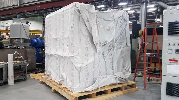 Large HVAC unit in shipping crate and vacuum wrapped