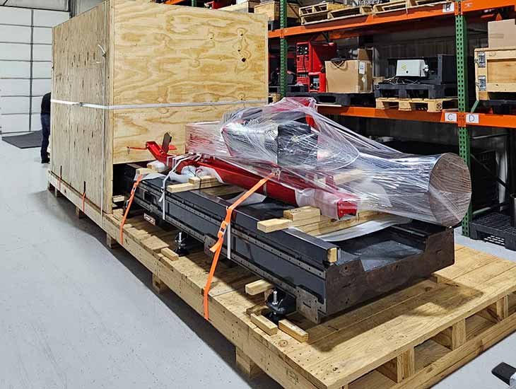 Oil field equipment on skid with hood box crating