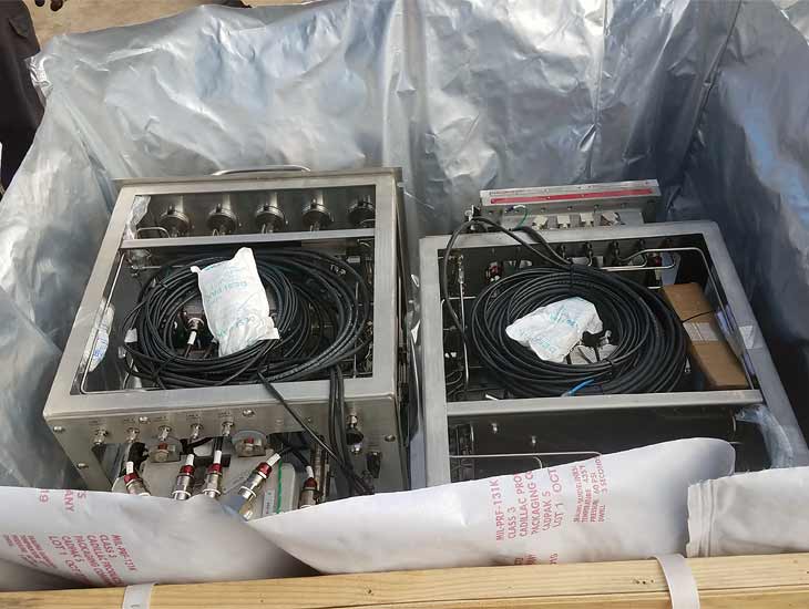 Vacumm wrapped electronics equipment in crate